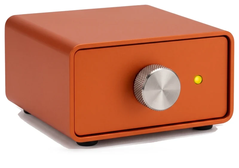 An orange anodised control box with a steel dial